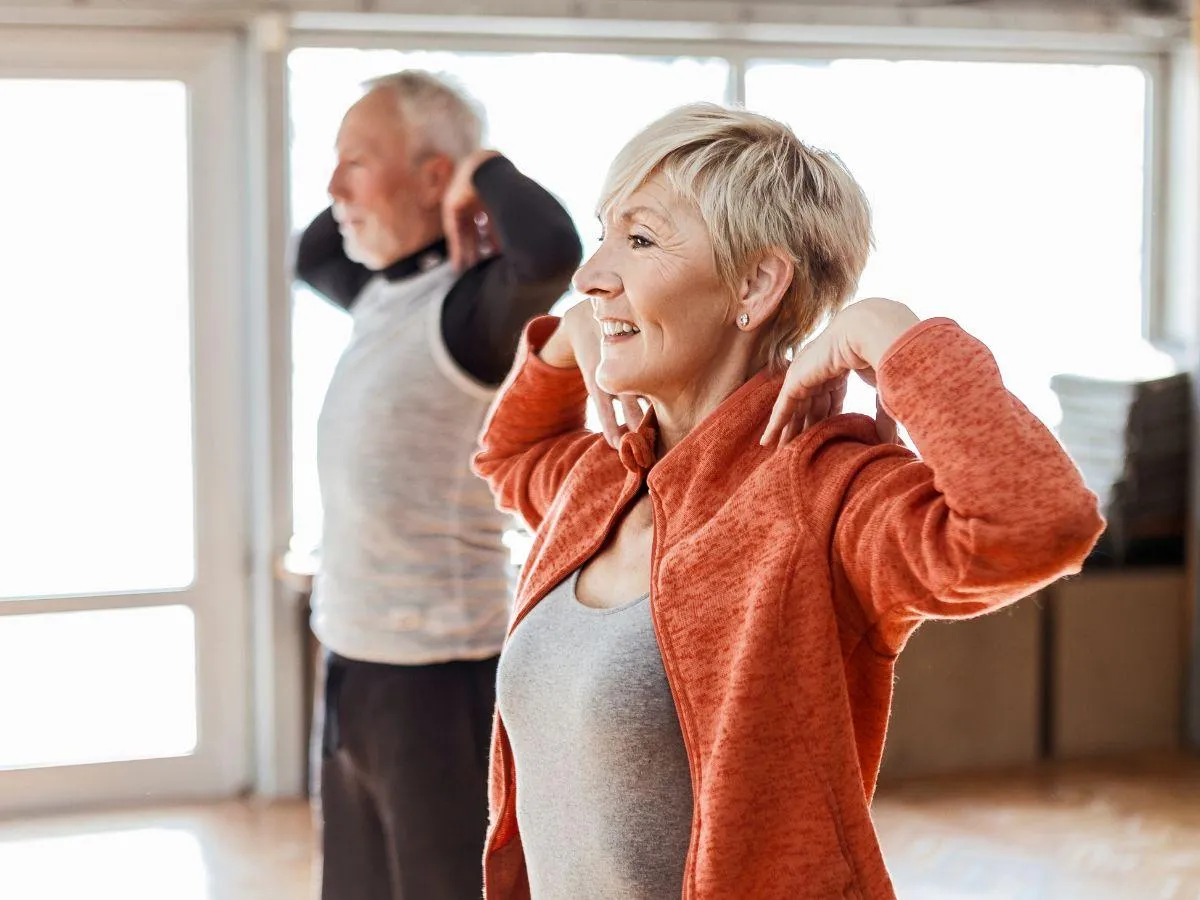 person holding amber glass bottle
