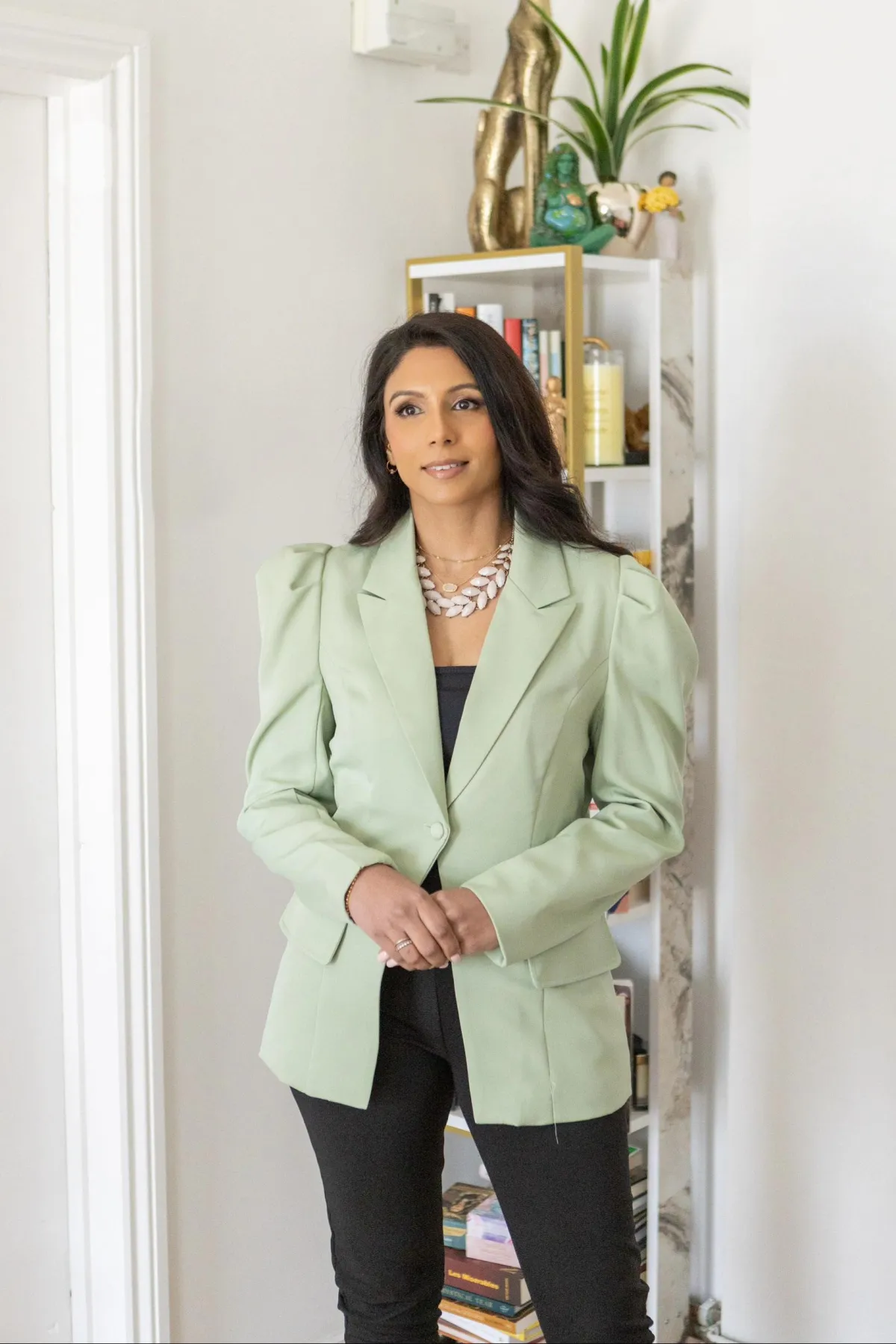 opened book near brown wood branch on sand under blue sky