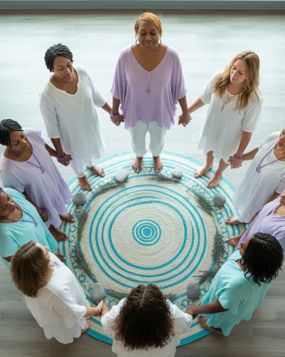 A person laying on the ground next to some shoes