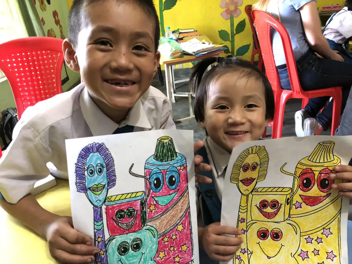 Students holding their art that they made