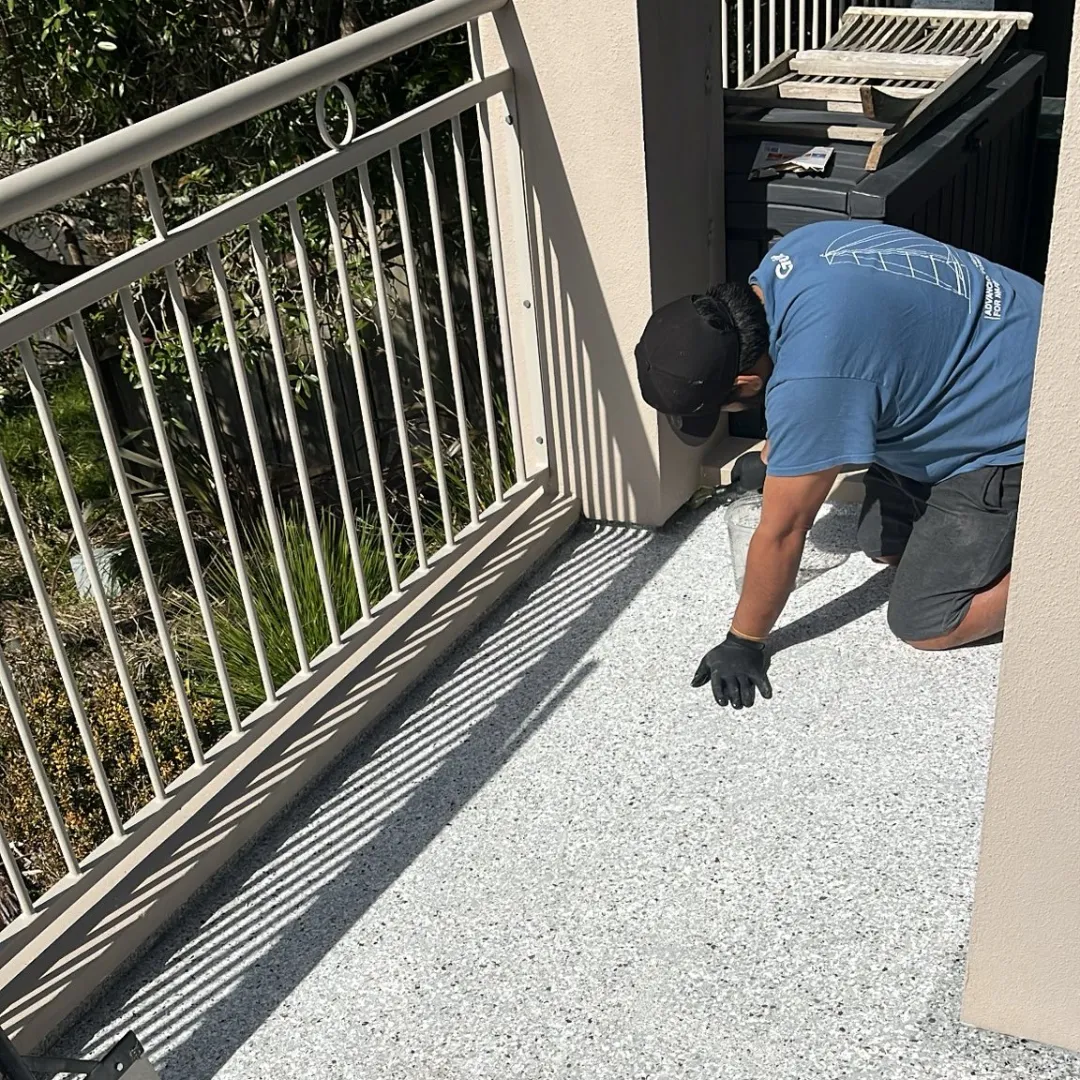 TQV Epoxy team applying floor coating in Auckland