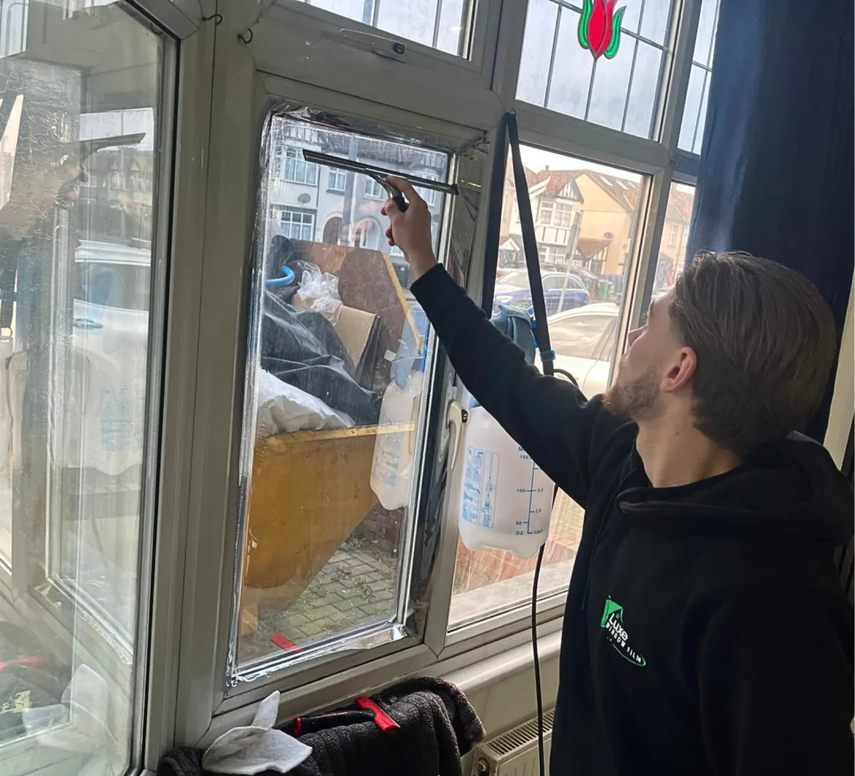 woman sitting on window