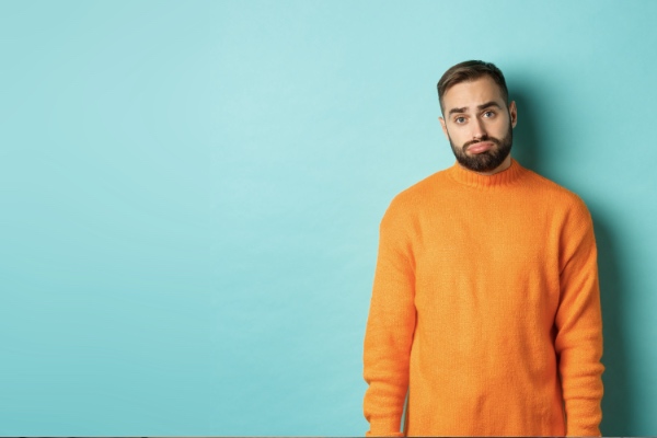 man in orange sweaater