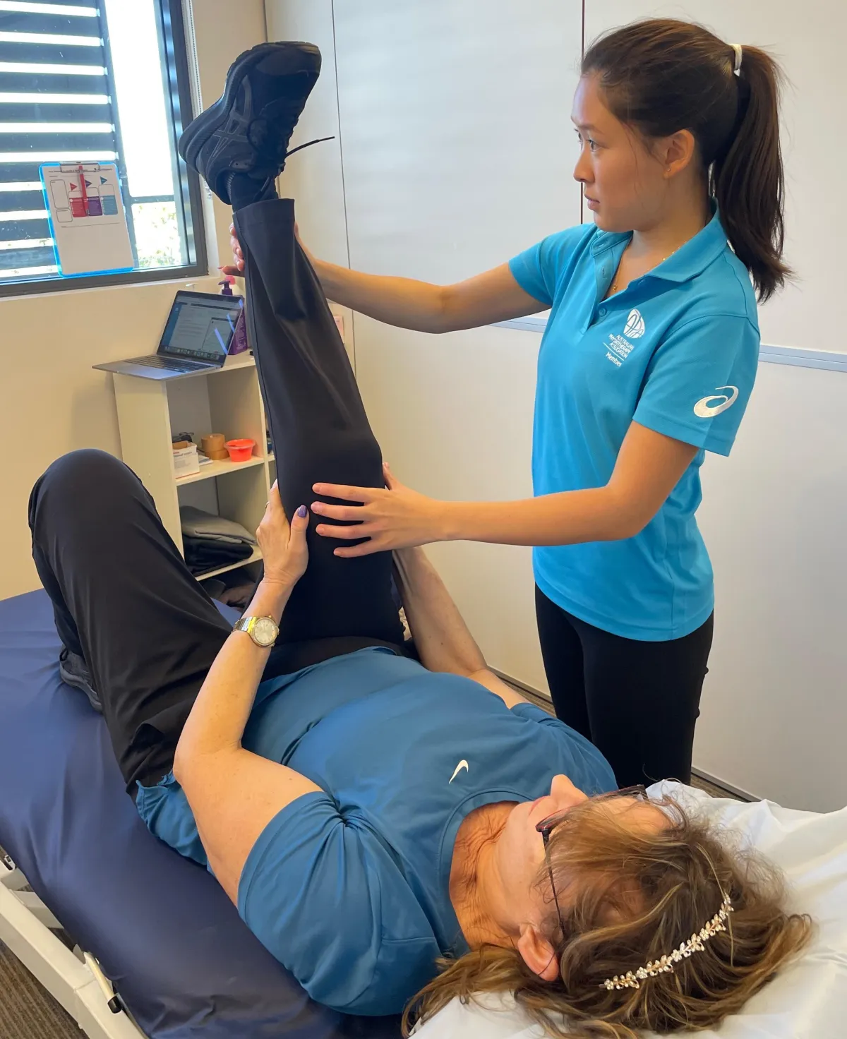 Physiotherapist treating client