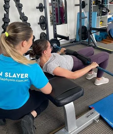 woman doing post natal exercise with physio 