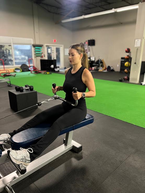 woman seriously performing gym exercise