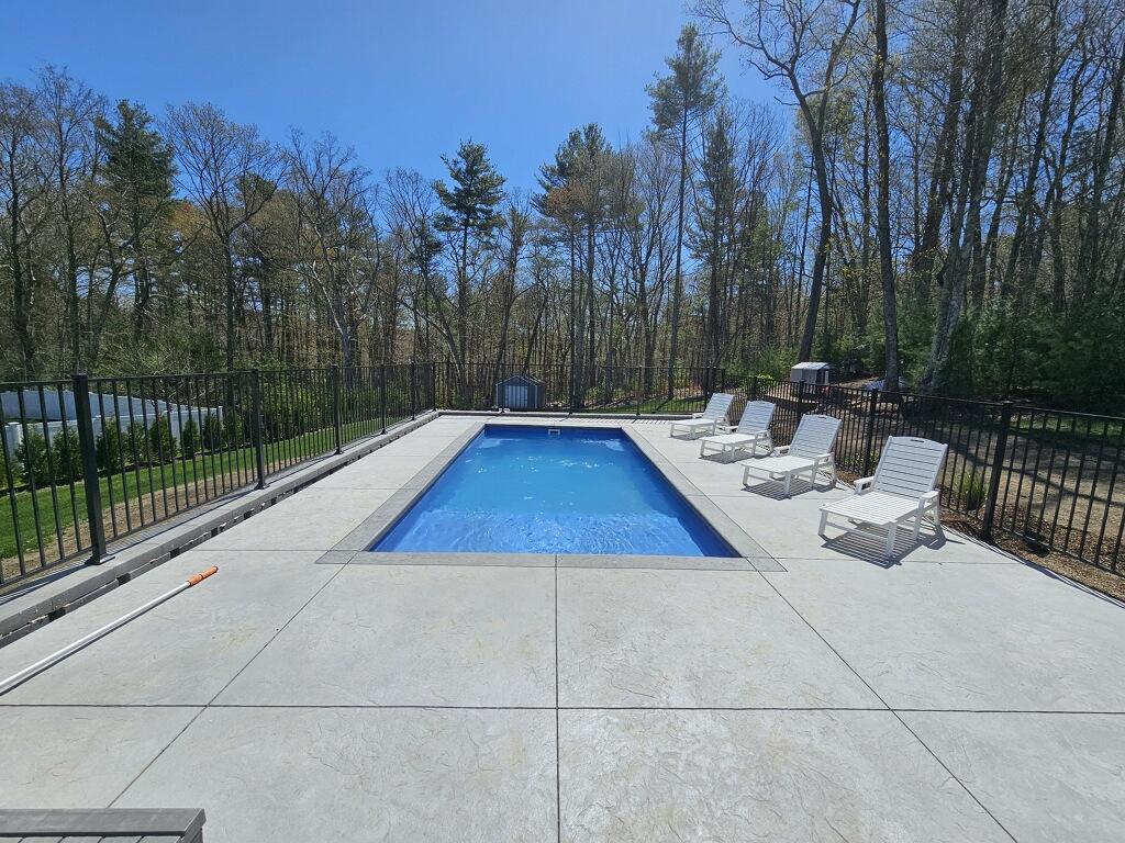 a swimming pool next to a beach