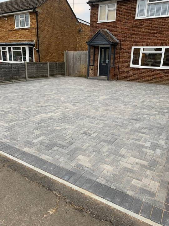 Charcoal block paved driveway in herringbone pattern in Hemel Hempstead