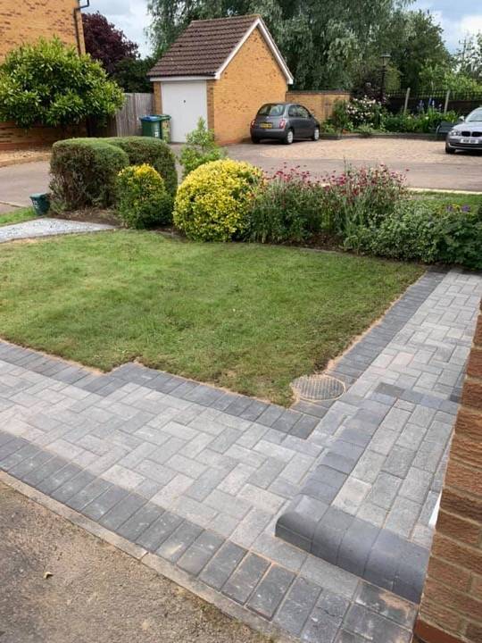Block paved path through garden with buff and silver blocks