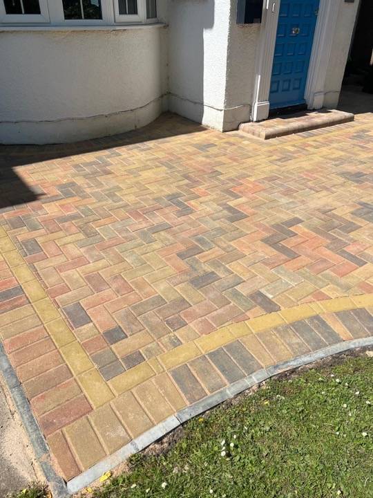 Buff and ochre block paved driveway at residential property in Hertfordshire