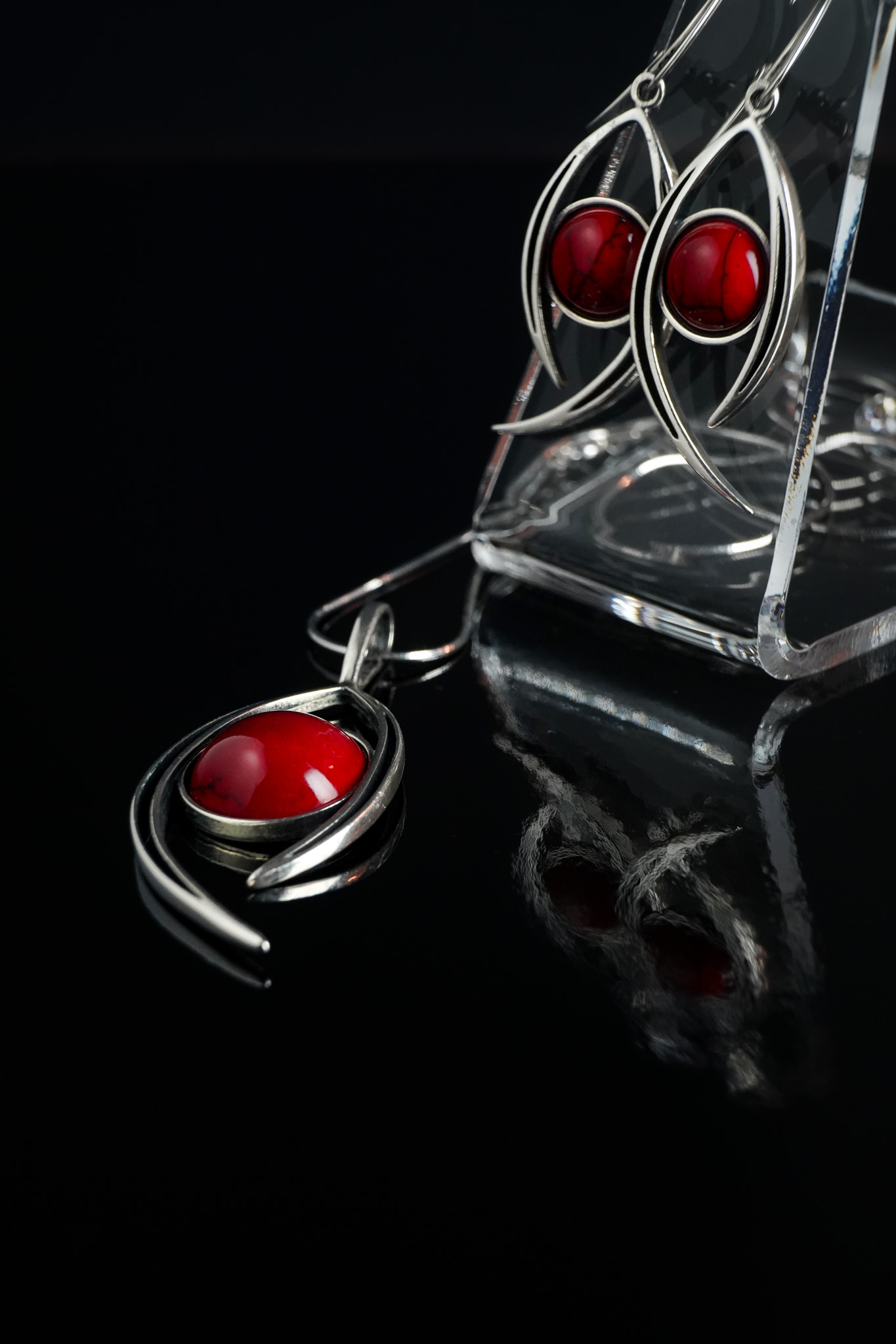 red jewellery on black reflection