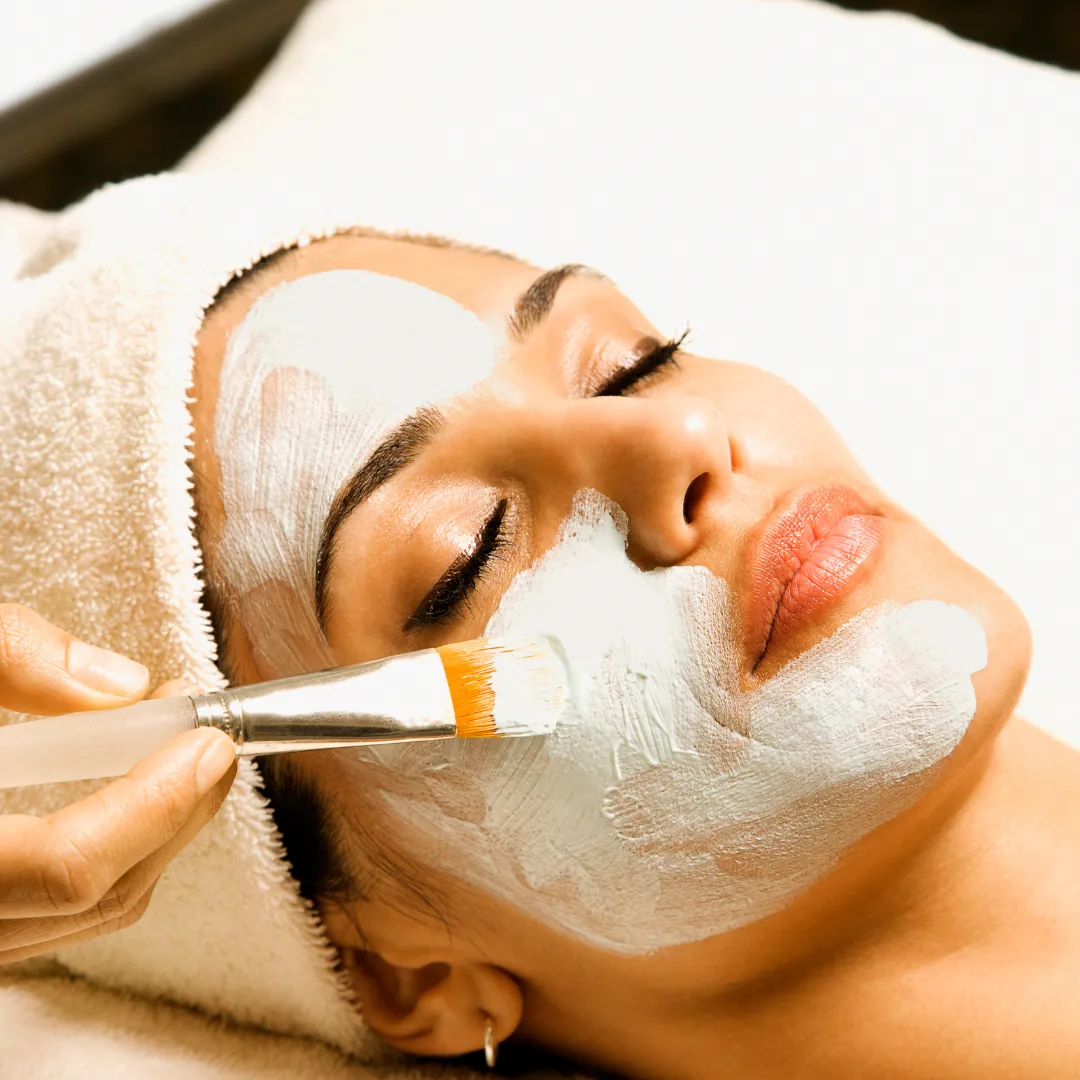 brown rock mountain with the distance of green trees near body of water