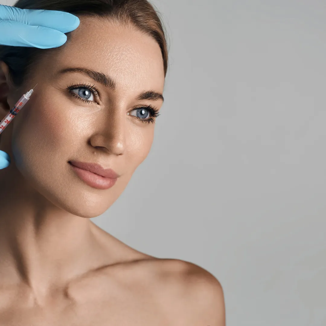 a bowl of sea salt with flowers in it