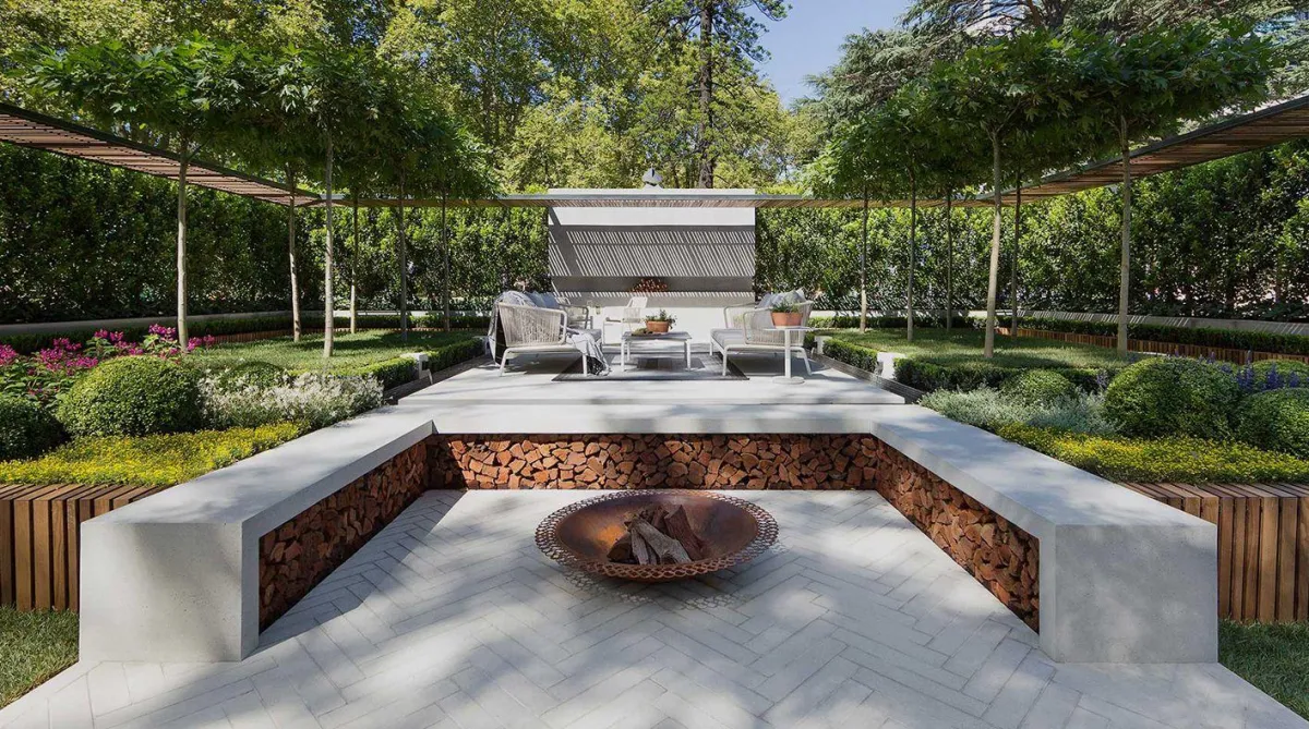 fields by duran: Contemporary garden design with sunken fire pit, concrete benches, manicured shrubs, and geometric landscaping.