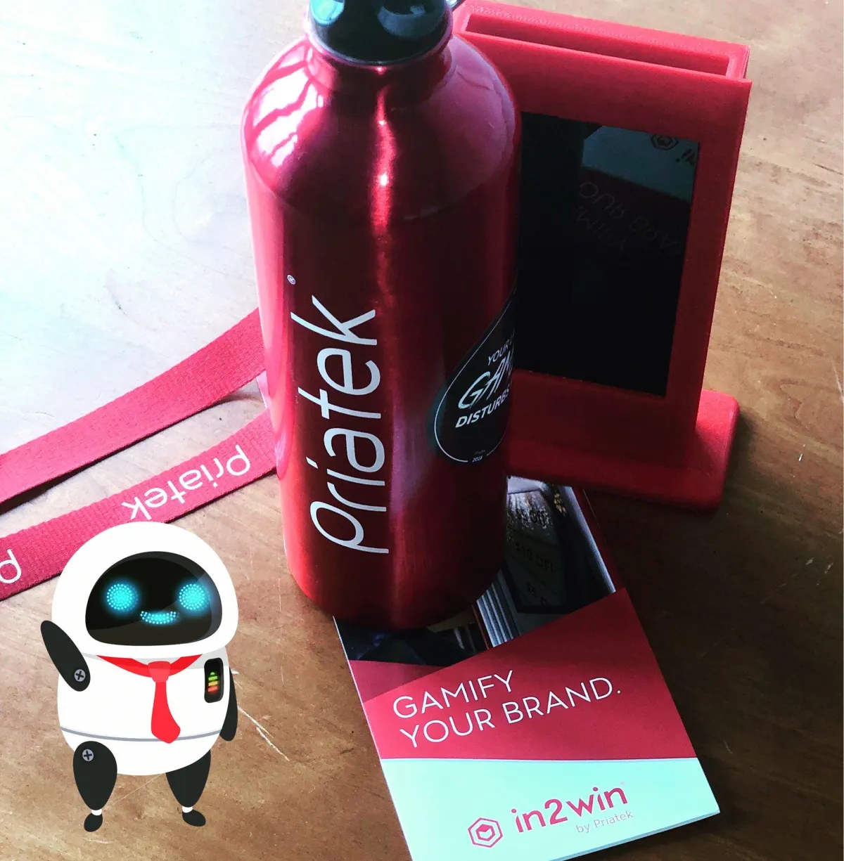 In2win® branded promotional items, including a red water bottle, card, and promotional display.