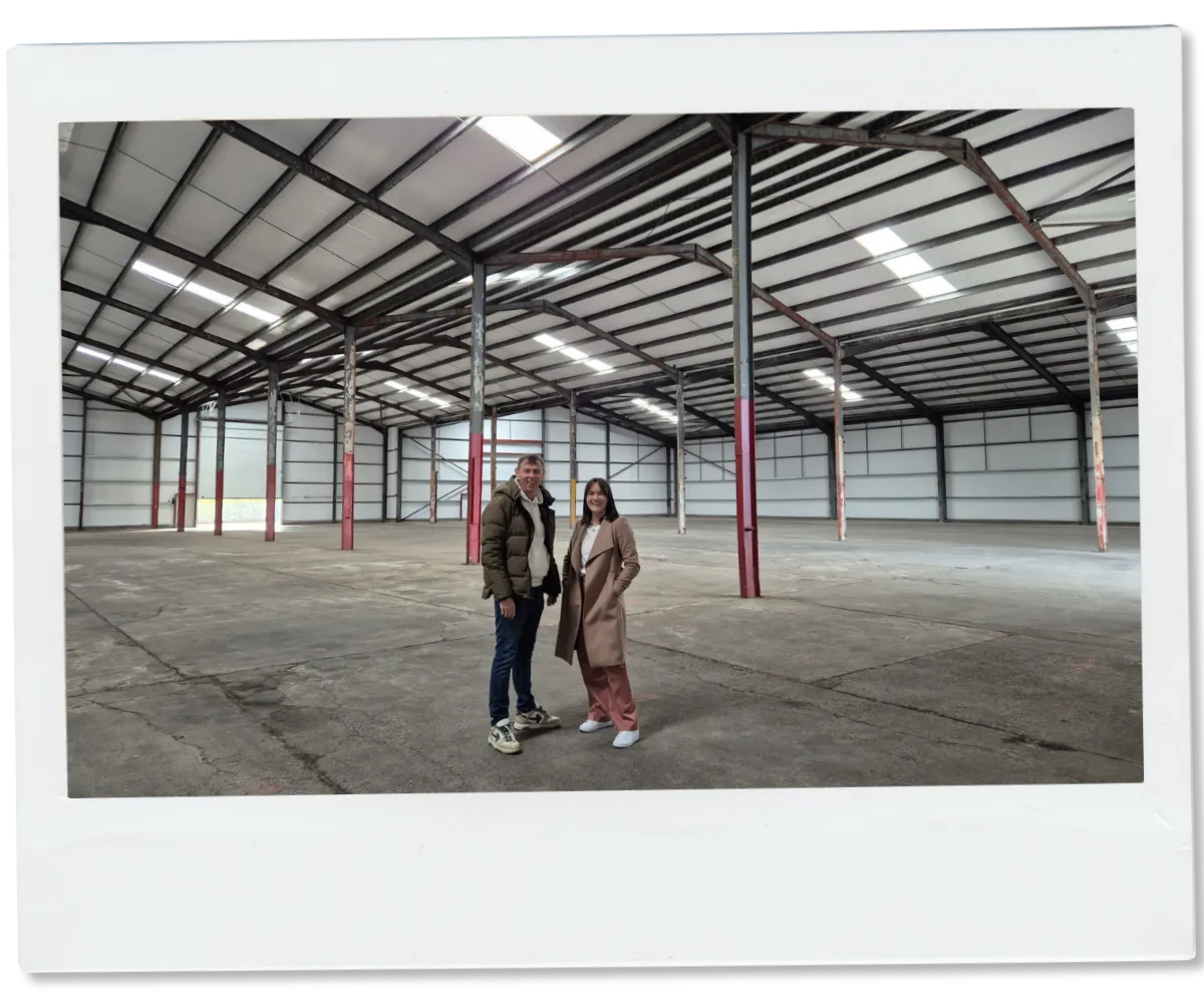 Lesley-Anne and James inside the Evorra Padel building at Perth Harbour during construction