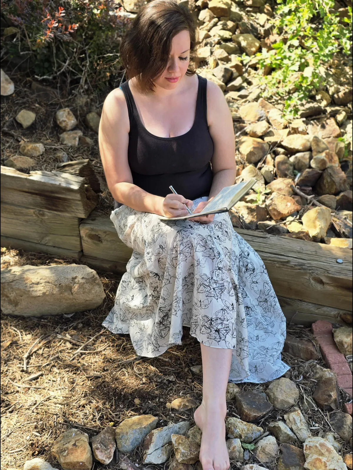 rebekah writing in her backyard