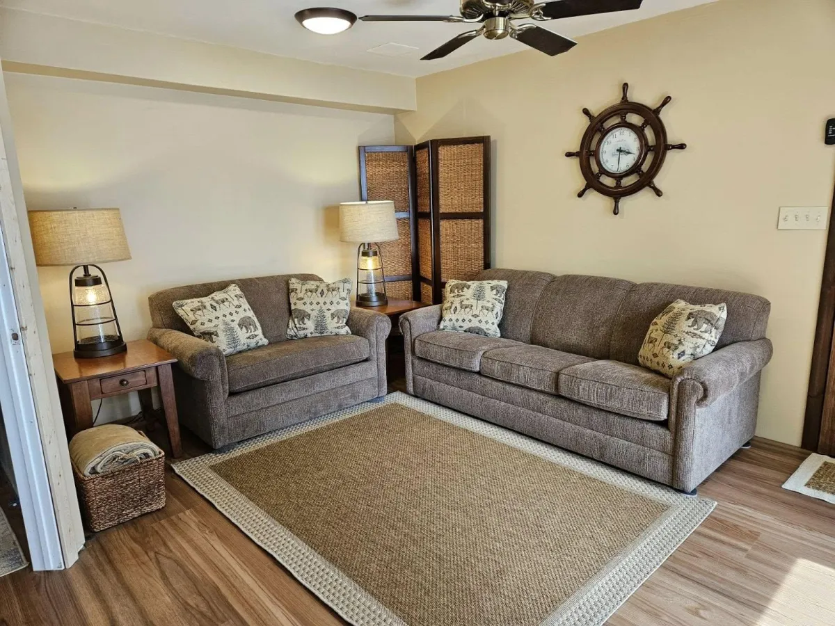 a living room filled with furniture and a flat screen tv