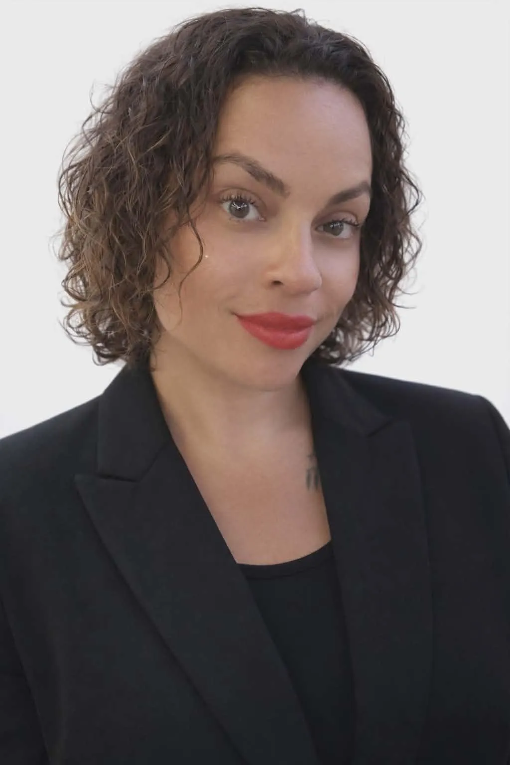 woman in black tank top and black shorts doing yoga on blue yoga mat