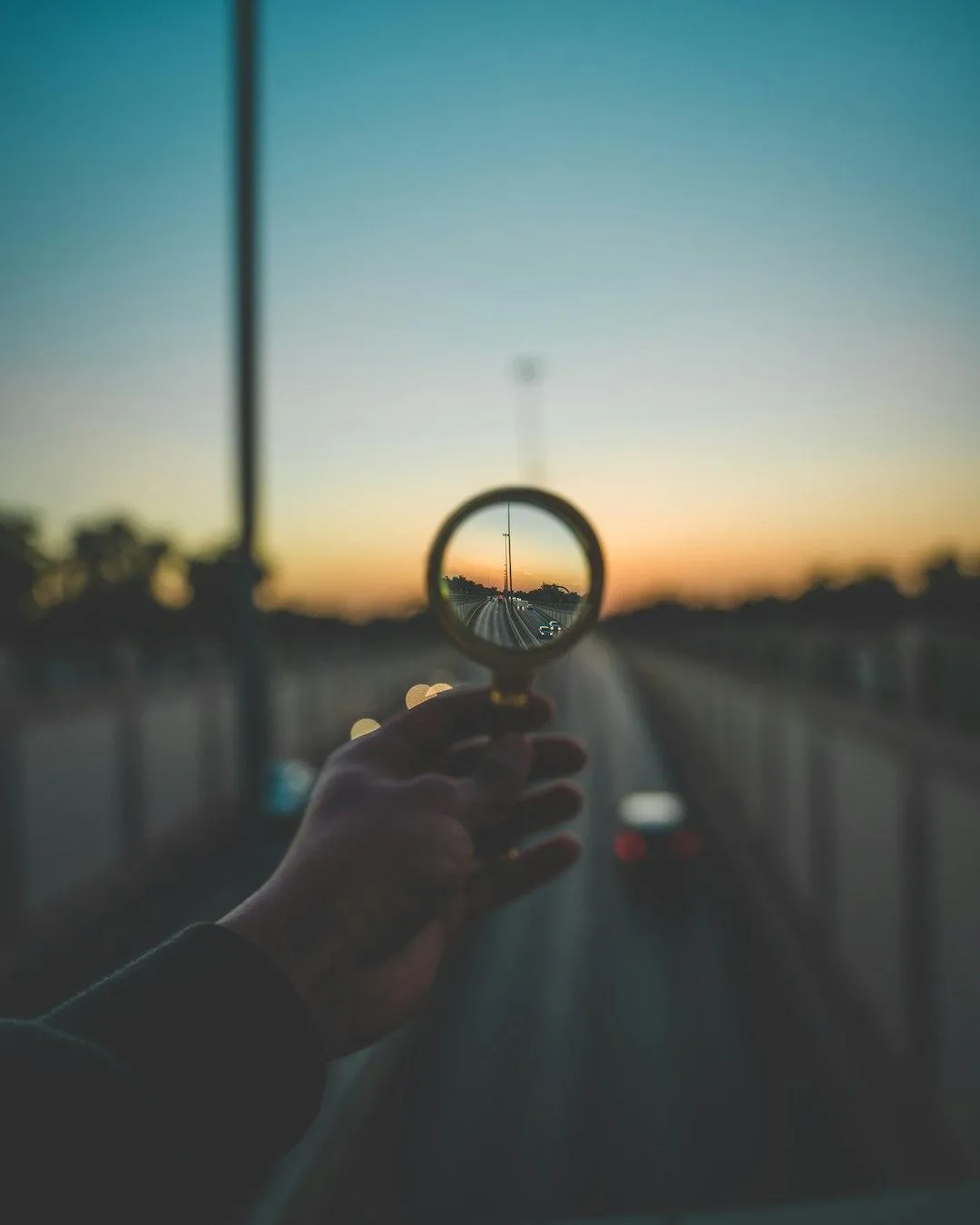 a large yellow truck driving down a dirt road