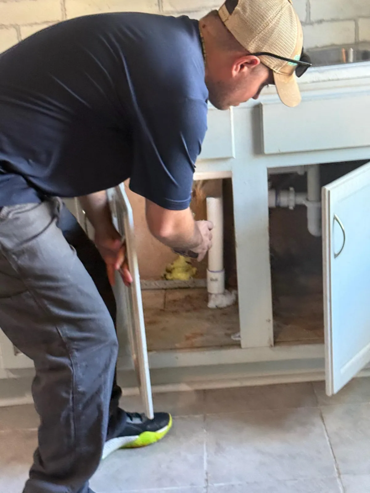 Redi Pest Control technician inspecting for termite activity