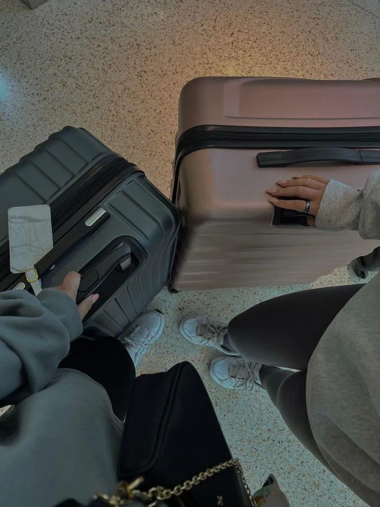 woman on kayak on body of water holding paddle