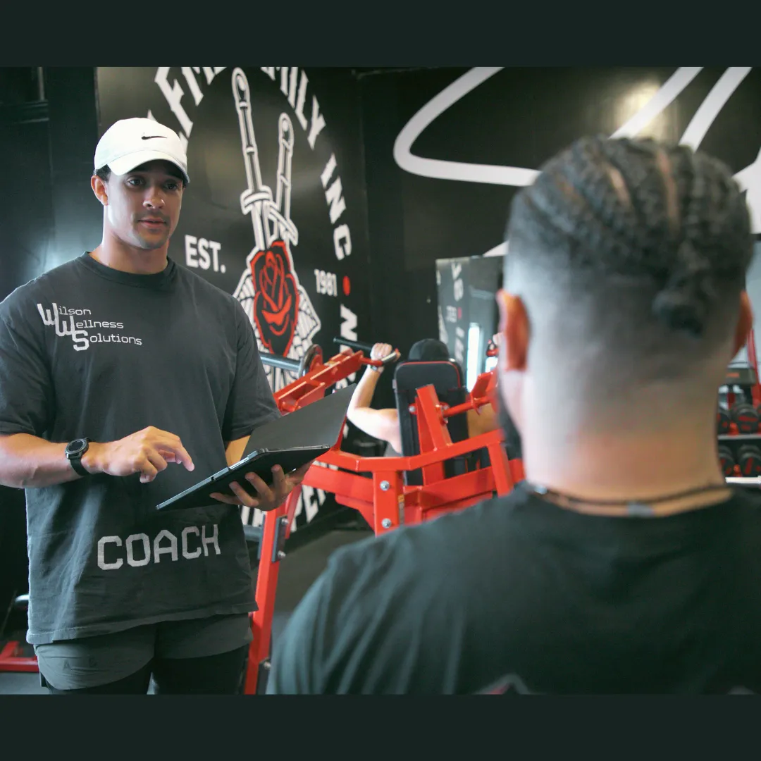 Personal trainer working with a client