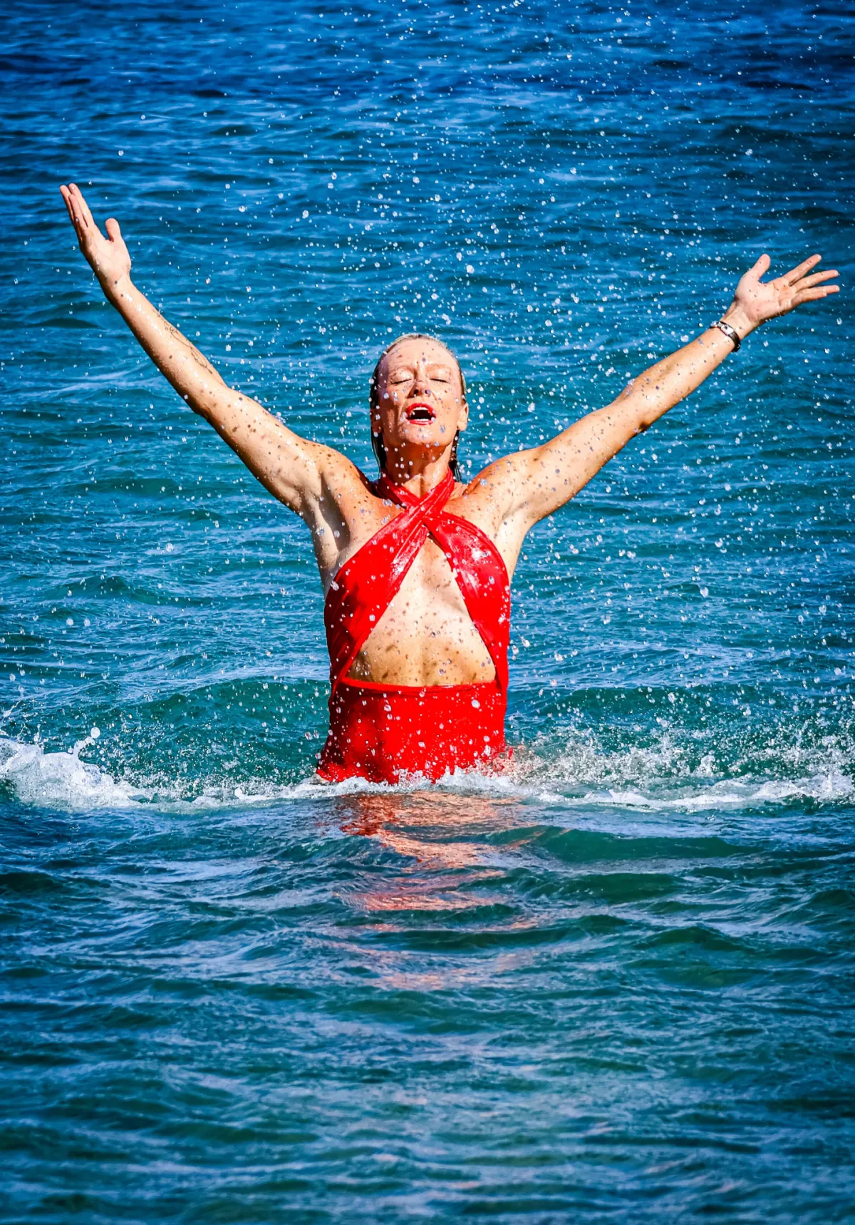 person holding stack of stones