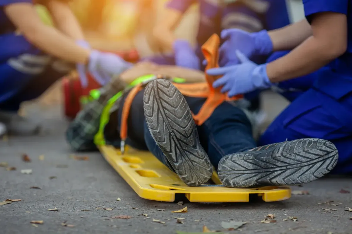 Medical responders treating a person on a stretcher during a cardiopulmonary resuscitation emergency response