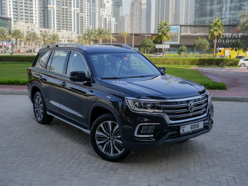 man in black jacket holding spark