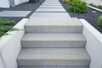 Concrete step installation on home entrance