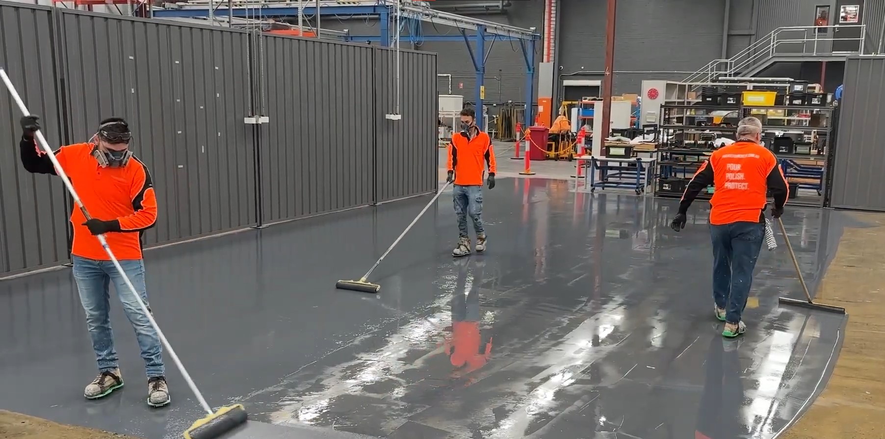 3 orange mean using squegee and rollers to spread epoxy over concrete floor
