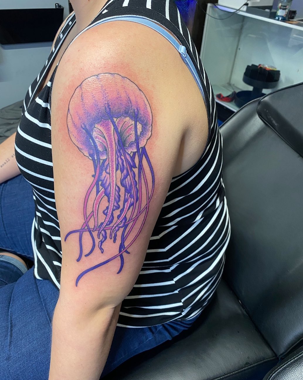 person with tattoo on right arm