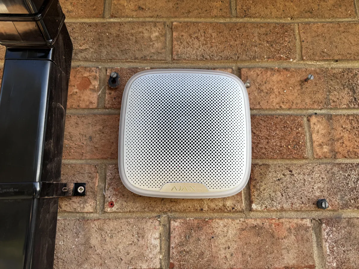 Smart alarm system siren installed on a wall