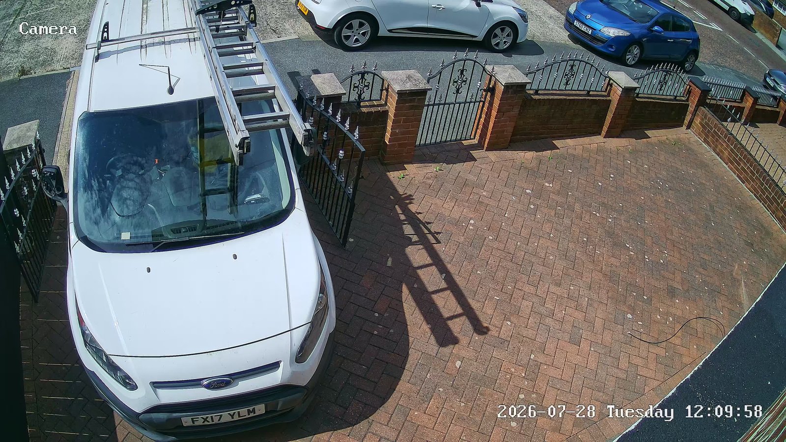 CCTV camera covering a block-paved driveway with a parked work van, installed by L&B Security