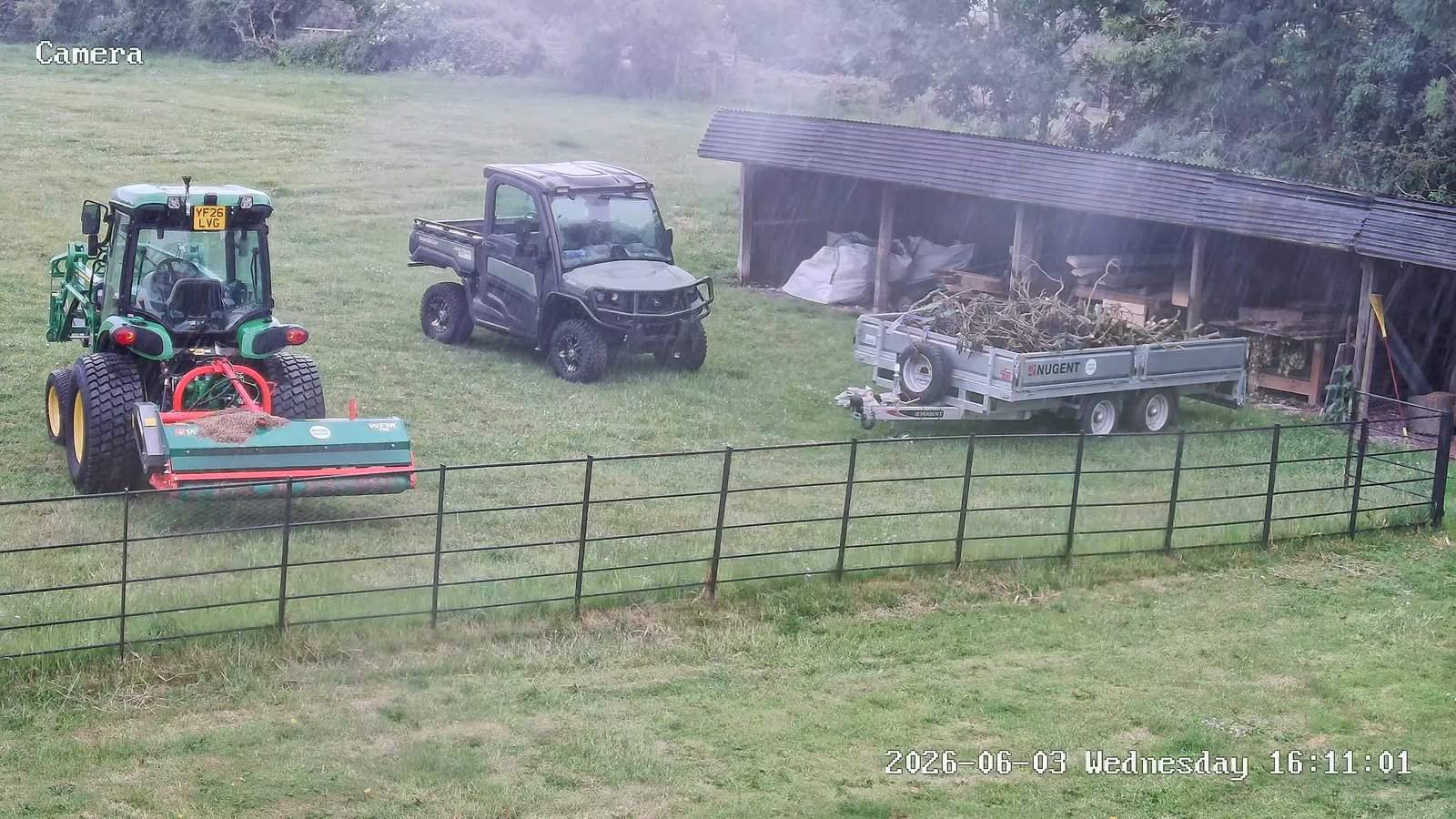 CCTV camera covering a field with a tractor, utility vehicle and storage shelter, installed by L&B Security