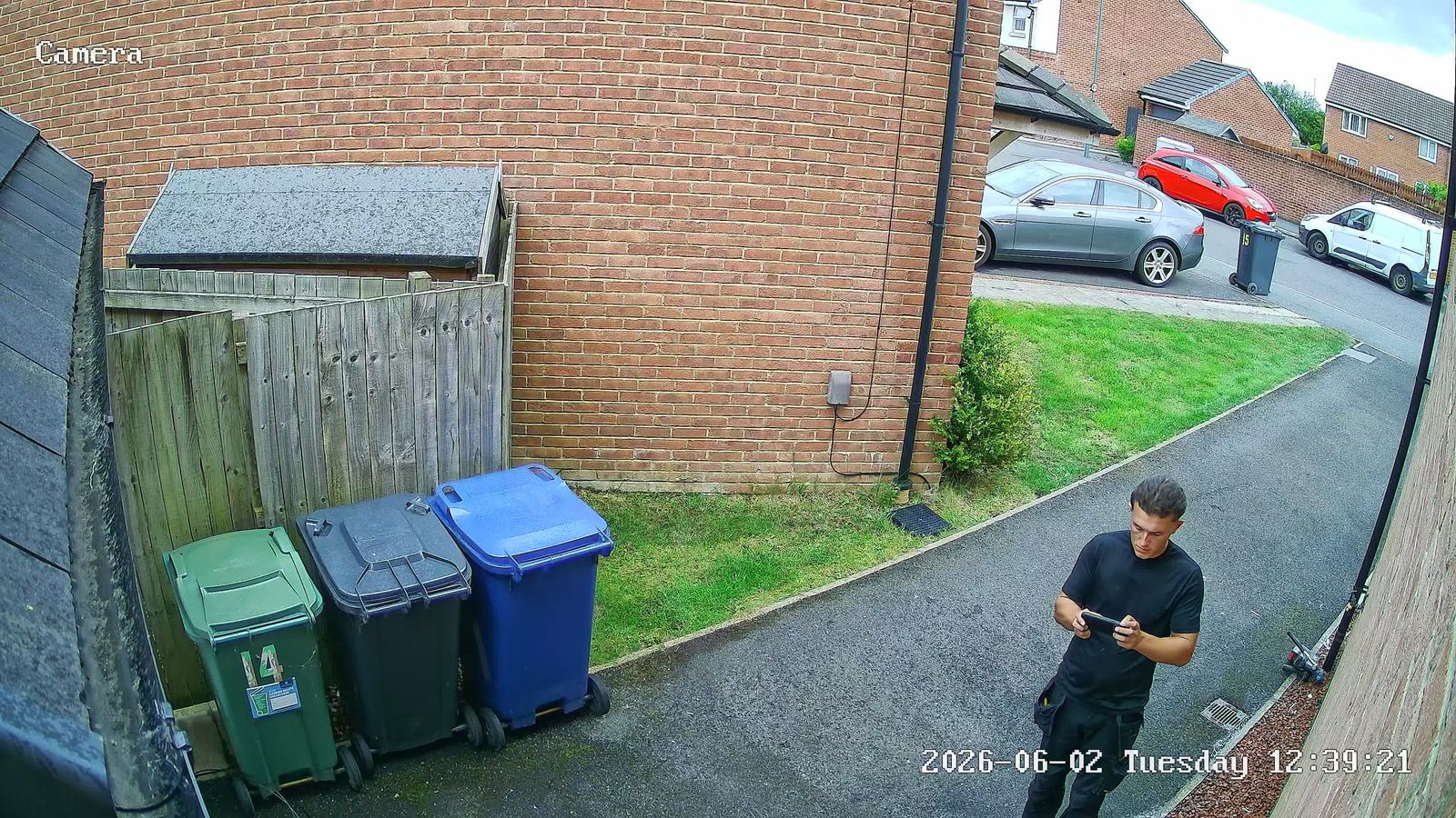 Billingham CCTV camera view of a side passage with wheelie bins