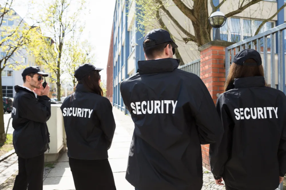 Security guard in uniform at a desk