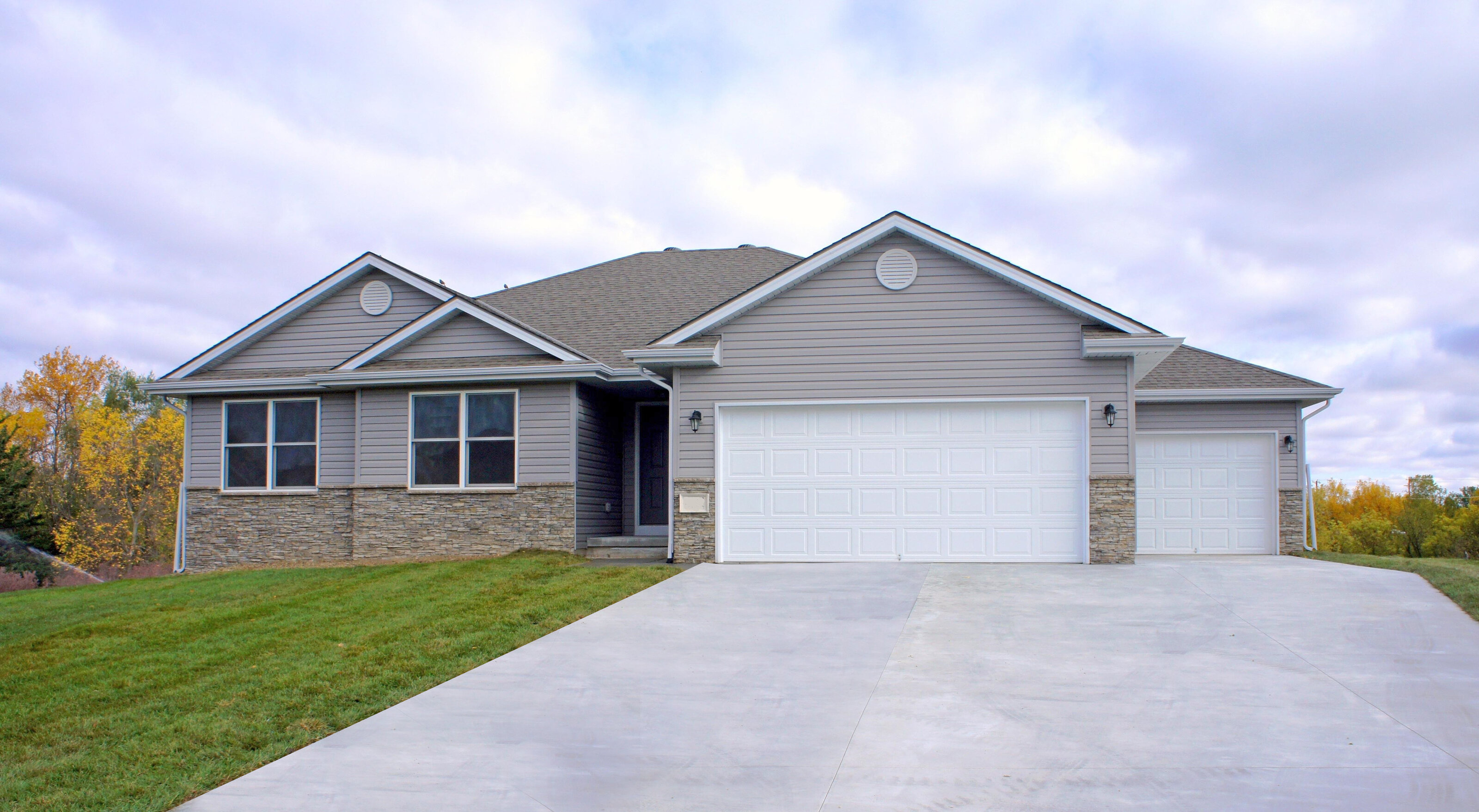 [Photo of a finished custom home exterior]