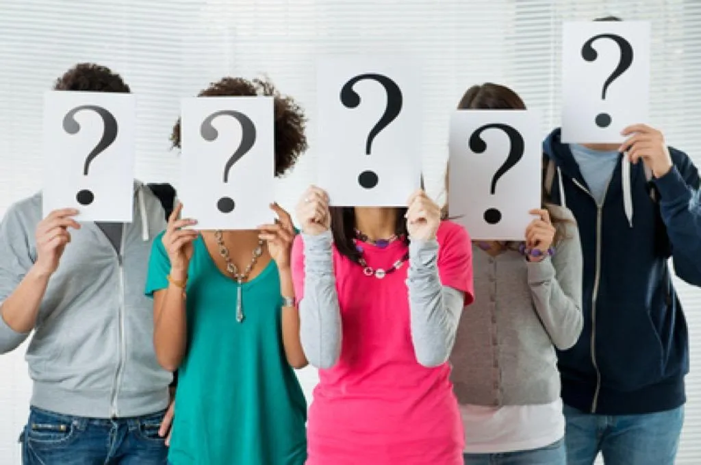 four person holding each others waist at daytime