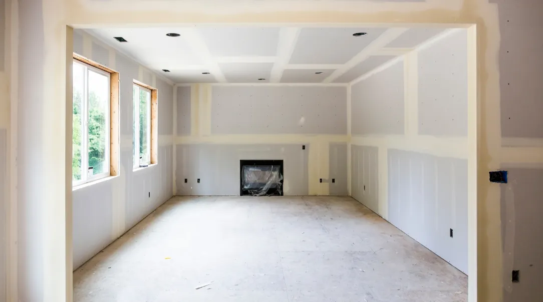 Luxury kitchen remodel with custom wood cabinetry, white quartz countertops, large center island, modern pendant lighting, and stainless steel appliances.