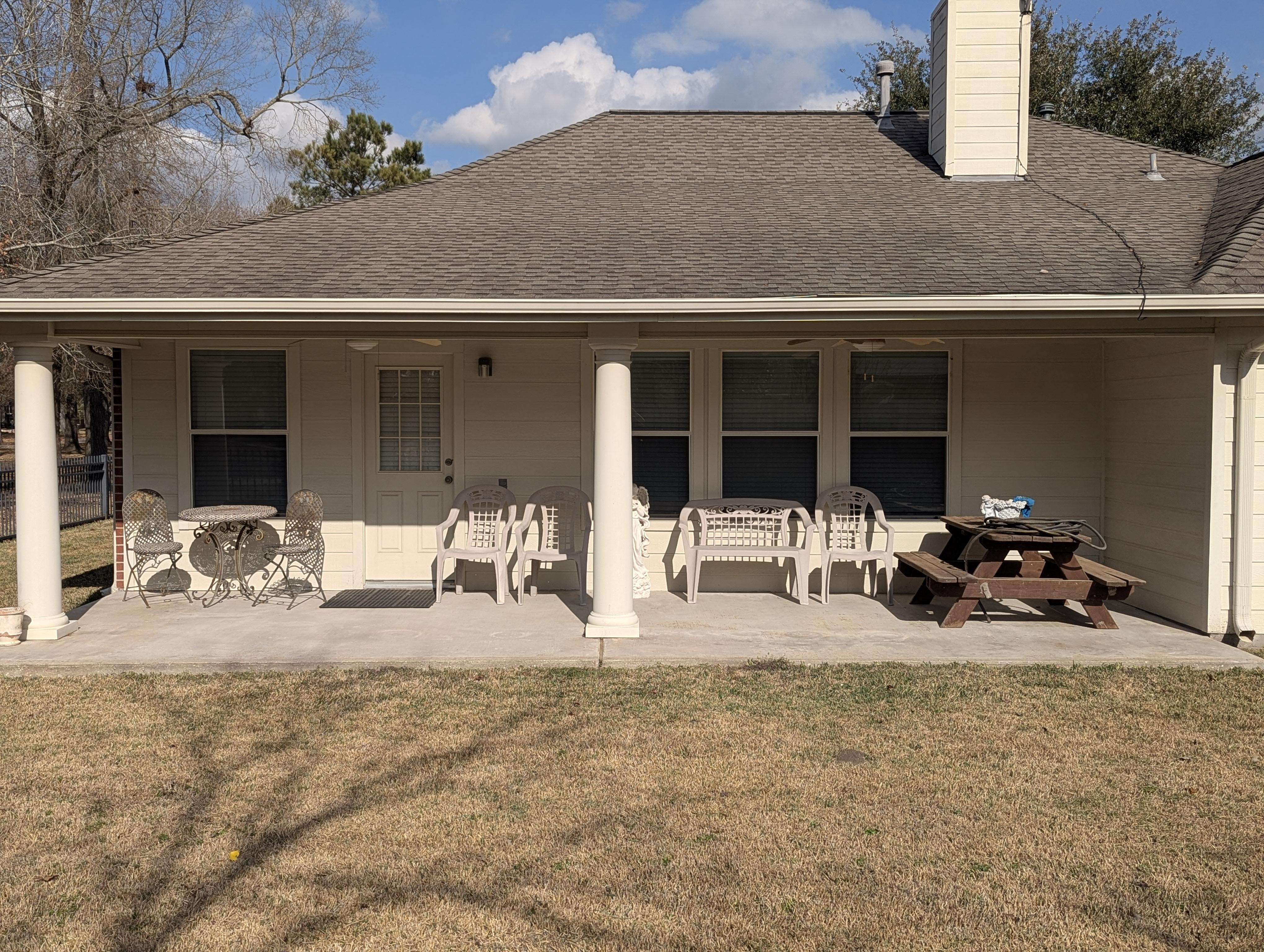 Patio cleaning in Houston TX – covered backyard patio and concrete slab pressure washed and restored by Pearl Pressure Washing HTX