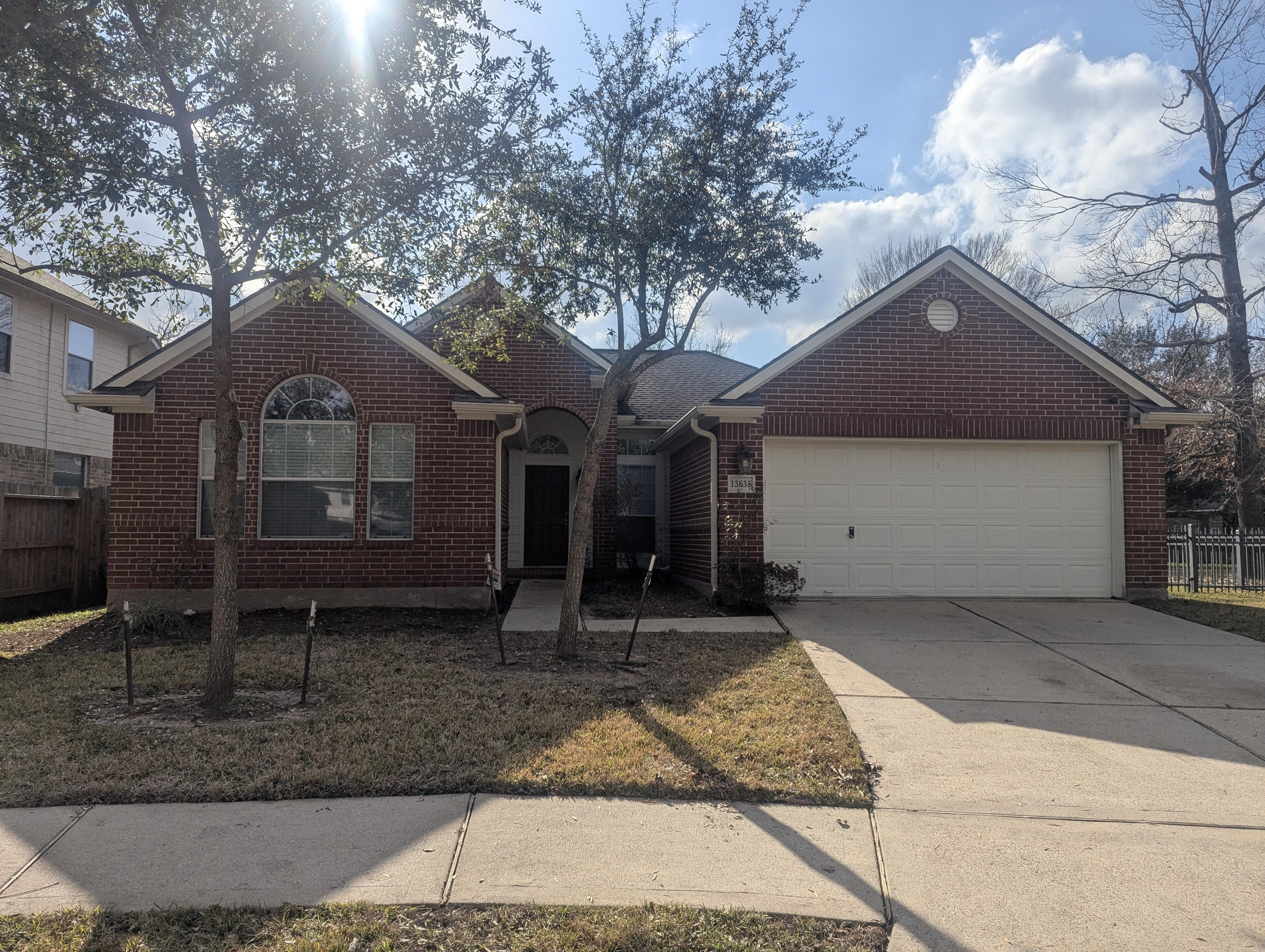 After professional house washing in Humble TX showing clean brick exterior and restored curb appeal