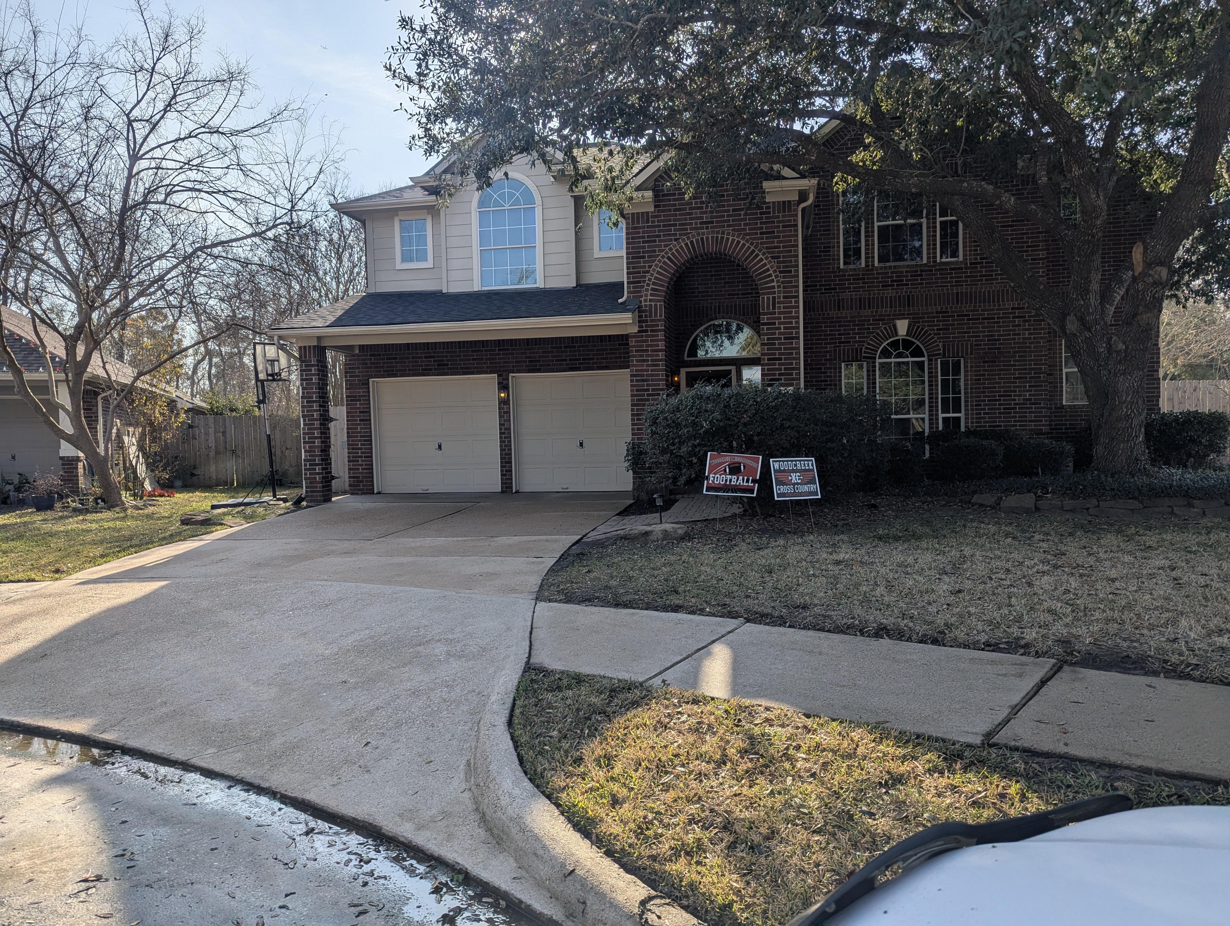 After house soft washing service in Houston TX removing algae, mold, and surface buildup from brick siding