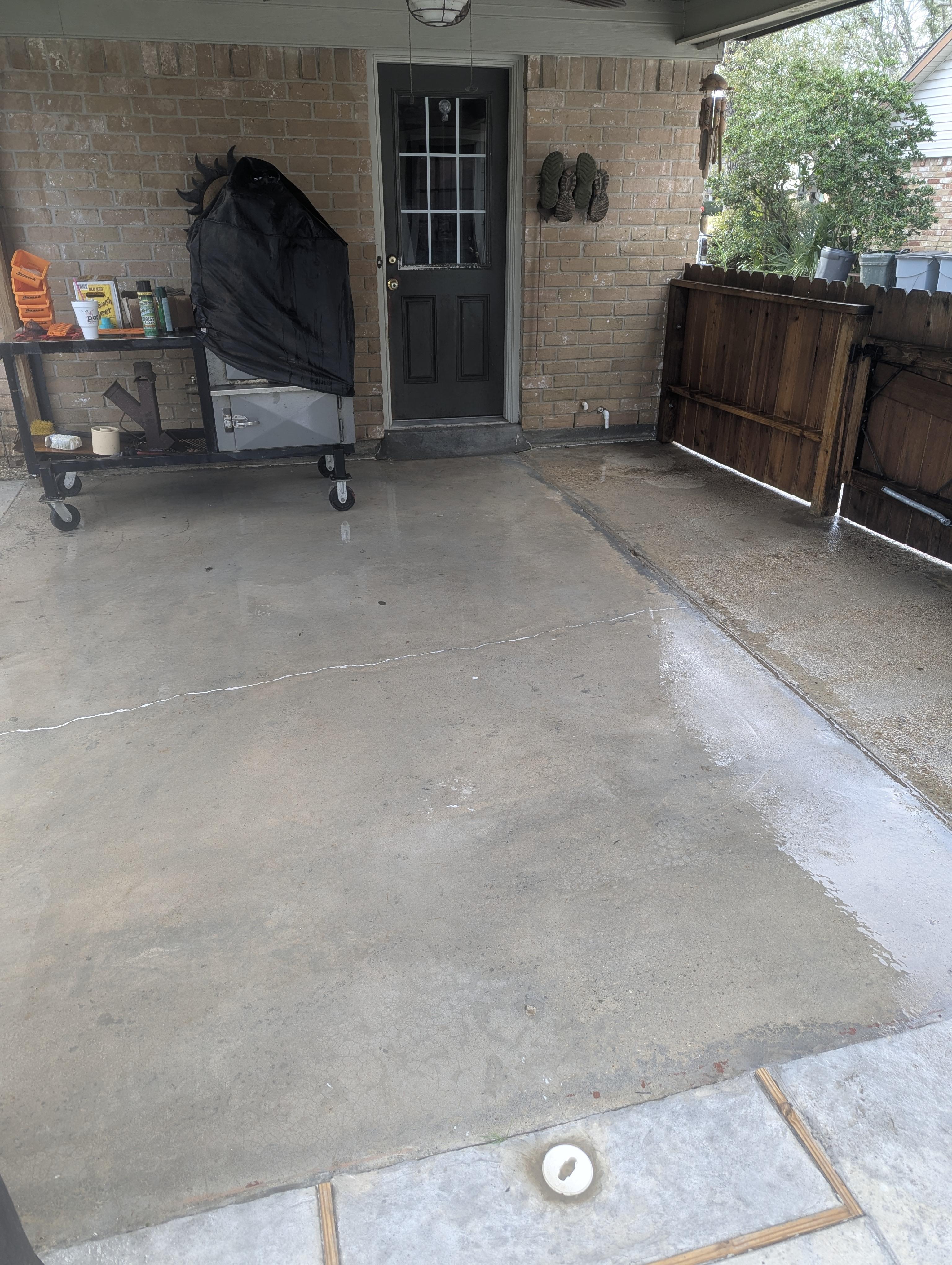 Patio and deck pressure washing in Houston Texas removing dirt, algae, and weather buildup from outdoor living areas