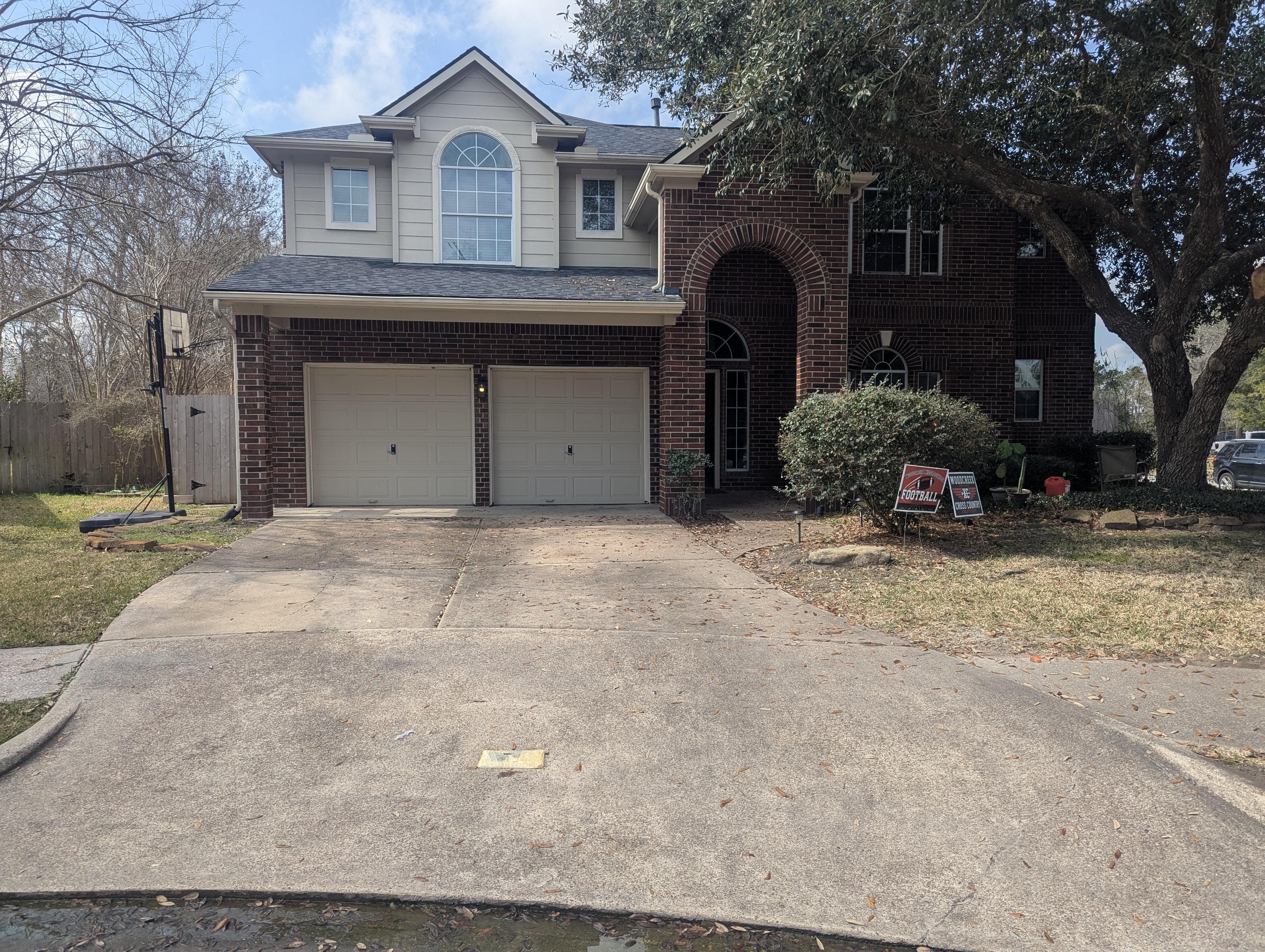 Before soft washing a residential brick home in Houston TX with visible dirt and organic buildup