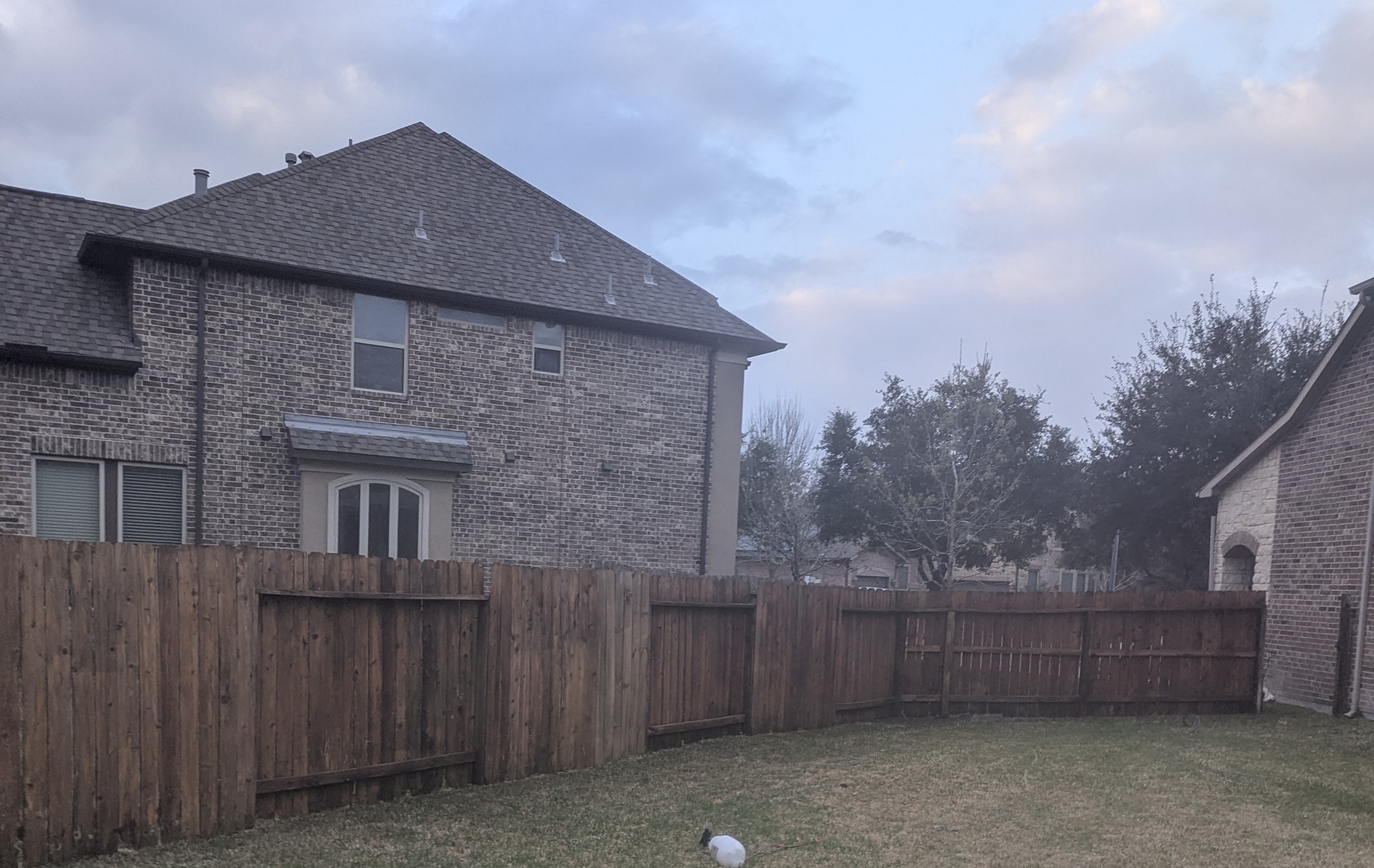 After wood fence pressure washing in Summerwood Houston TX restoring natural wood color and removing buildup