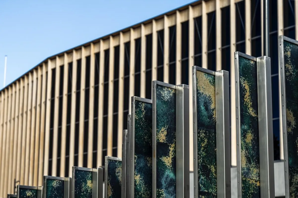 Ocean Rise glass panels from an angle against blue sky