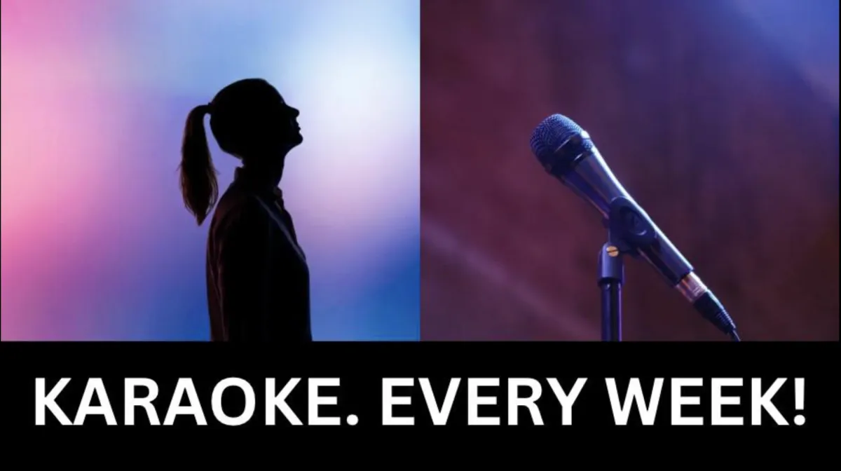 A fire pit sitting on top of a lush green field