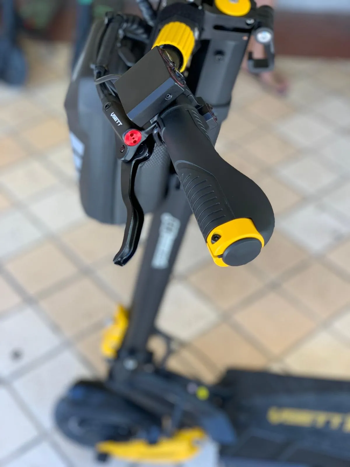 man in black suit riding on blue motor scooter